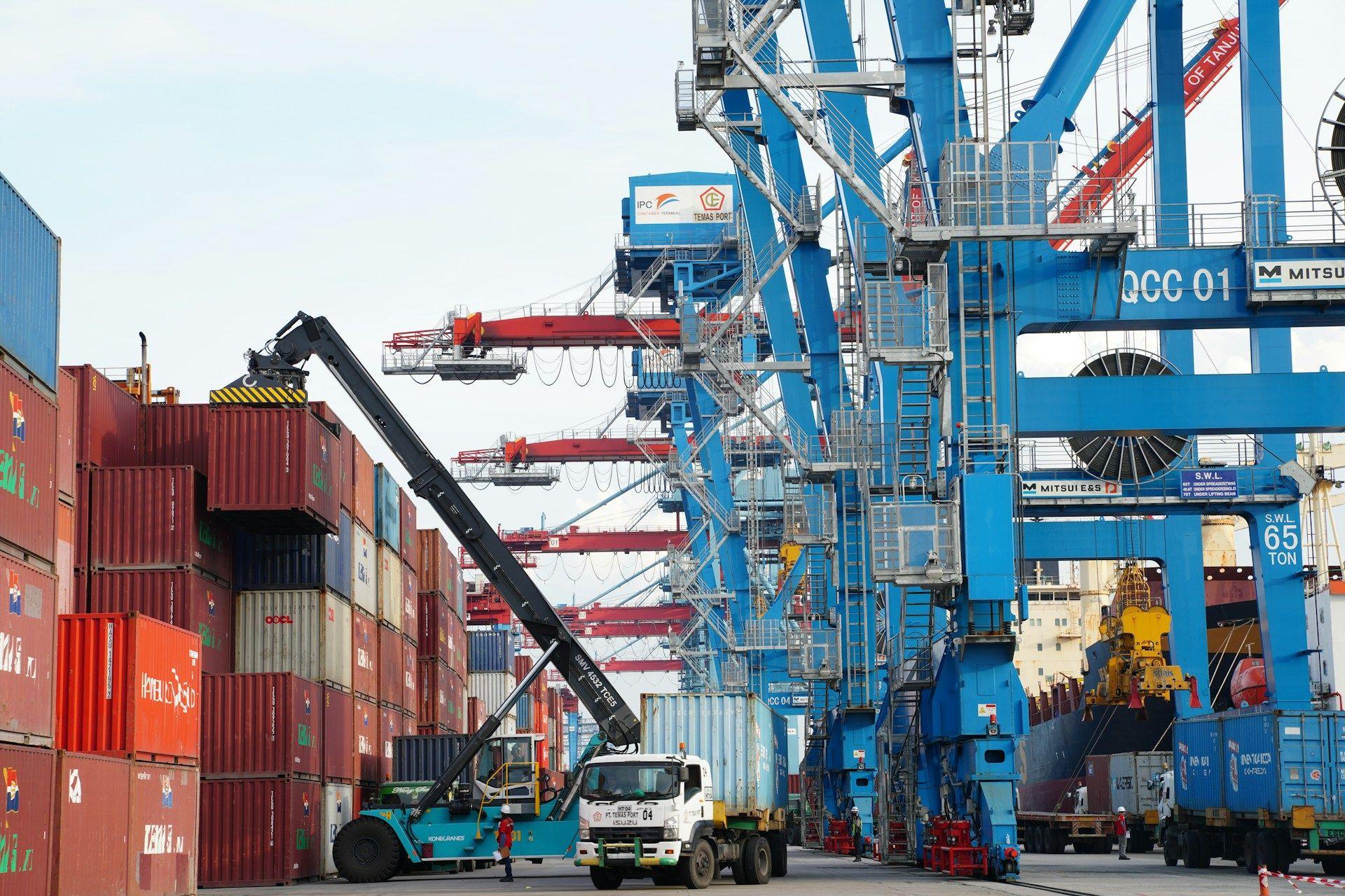 Container cranes and a truck at a port terminal